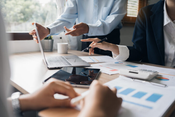 Group of IT consultant working by digital tablet and management big data and analyze financial document of company.